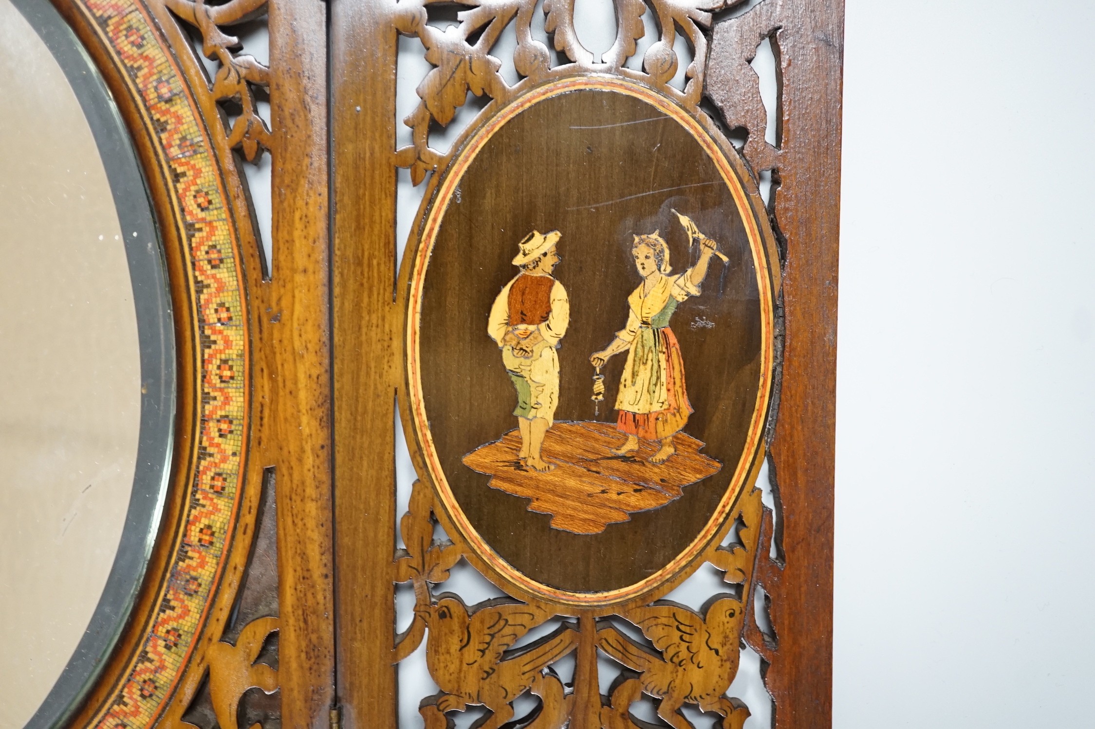 A 19th century fretted olivewood Sorrento ware toilet mirror, 45cm long
